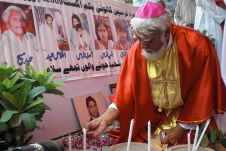 Bishop Coutts Lighting Candles for Victims of Persecution